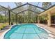 Private pool area complete with screened enclosure, patio space, and outdoor kitchen at 18026 Nutcracker Rd, Weeki Wachee, FL 34614