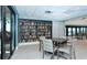 Bright library area with extensive bookshelves and comfortable seating for reading at 2045 Gulf Of Mexico Dr # 207, Longboat Key, FL 34228