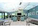 Bright community lounge area with ample seating, stylish decor, and ocean views at 2045 Gulf Of Mexico Dr # M1-207, Longboat Key, FL 34228
