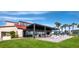 Outdoor patio with tables and chairs, perfect for dining and enjoying the views of the surrounding area at 2045 Gulf Of Mexico Dr # M1-207, Longboat Key, FL 34228