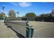 Well-maintained tennis court featuring a modern net and convenient trash receptacle at 2045 Gulf Of Mexico Dr # M1-207, Longboat Key, FL 34228