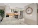 Modern kitchen with stainless steel appliances and granite countertops at 2045 Gulf Of Mexico Dr # M1-207, Longboat Key, FL 34228