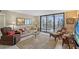 Comfortable living room with access to a patio through sliding glass doors at 2045 Gulf Of Mexico Dr # M1-207, Longboat Key, FL 34228