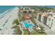 A stunning aerial view of the community pool, beach and condos near the ocean at 2045 Gulf Of Mexico Dr # M1-207, Longboat Key, FL 34228