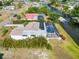 Aerial view of the home showing the pool, yard, and waterfront access at 21152 Higgs Dr, Port Charlotte, FL 33952