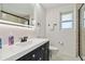 Modern bathroom featuring a sleek vanity with matte black fixtures and a glass-enclosed shower at 21152 Higgs Dr, Port Charlotte, FL 33952