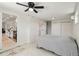 Bedroom featuring ceiling fan, neutral walls, and a full ensuite bathroom at 21152 Higgs Dr, Port Charlotte, FL 33952