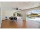 A spacious game room featuring a poker table with a view of the pool at 21152 Higgs Dr, Port Charlotte, FL 33952