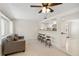 Comfortable living room with bar stool seating and open view into the kitchen and dining area at 21152 Higgs Dr, Port Charlotte, FL 33952