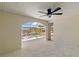 A bright living space featuring a pool and waterfront view through an arched doorway at 21152 Higgs Dr, Port Charlotte, FL 33952