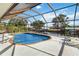 Screened-in pool overlooking the waterfront with beautiful blue skies at 21152 Higgs Dr, Port Charlotte, FL 33952