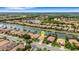 Aerial view of home on a canal with mature landscaping at 212 River Enclave Ct, Bradenton, FL 34212
