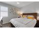 Cozy bedroom with a white comforter, yellow pillows, and a wooden headboard offering a relaxing retreat at 212 River Enclave Ct, Bradenton, FL 34212