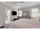 Spacious bedroom with large windows, ensuite bathroom, and walk-in closet providing great natural light at 212 River Enclave Ct, Bradenton, FL 34212
