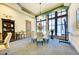 Intimate conference room with glass table, seating for six, and large picture windows at 212 River Enclave Ct, Bradenton, FL 34212