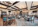 Spacious clubhouse dining area with elegant tables, chairs, and chandeliers at 212 River Enclave Ct, Bradenton, FL 34212