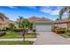 Charming home featuring a two-car garage, well-maintained lawn, and inviting curb appeal at 212 River Enclave Ct, Bradenton, FL 34212