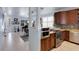 Spacious kitchen with stainless steel appliances, granite counters, open dining area at 212 River Enclave Ct, Bradenton, FL 34212