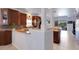Well-lit kitchen showcasing wooden cabinets, granite counters, and modern design at 212 River Enclave Ct, Bradenton, FL 34212