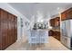 Bright kitchen features granite counters, stainless steel appliances, and spacious cabinets at 212 River Enclave Ct, Bradenton, FL 34212