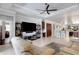 Open-concept space features a living room, kitchen, and office area with tile floors at 212 River Enclave Ct, Bradenton, FL 34212