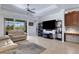 Living room offers neutral decor, tile floors, and is conveniently located next to the office at 212 River Enclave Ct, Bradenton, FL 34212