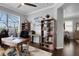 Spacious home office with a wooden desk and bookshelves, offering a quiet workspace at 212 River Enclave Ct, Bradenton, FL 34212