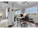 Home office provides a desk area, exercise equipment, and great outdoor views at 212 River Enclave Ct, Bradenton, FL 34212