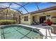 A screened-in pool is steps away from the home's covered patio and outdoor living area at 212 River Enclave Ct, Bradenton, FL 34212