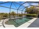 Inviting screened-in pool area with tranquil water views, perfect for relaxation and outdoor enjoyment at 212 River Enclave Ct, Bradenton, FL 34212