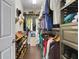 Organized walk-in closet with shelves and rods, offering ample storage space for clothes, shoes, and accessories at 212 River Enclave Ct, Bradenton, FL 34212