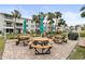 Picnic tables and umbrellas offer outdoor dining options for residents at 2207 Sunset Dr # E5, Bradenton, FL 34207