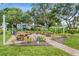 Picnic tables shaded by mature trees offer a relaxing spot for residents at 2207 Sunset Dr # E5, Bradenton, FL 34207