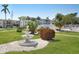 A water fountain sits among manicured landscaping in this quiet condo community at 2207 Sunset Dr # E5, Bradenton, FL 34207
