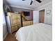 Cozy bedroom featuring a large bed, hard-wood floors, and neutral tones; a comfortable space for relaxation at 2207 Sunset Dr # E5, Bradenton, FL 34207