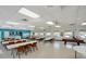 Large recreation room features tables, chairs, and a pool table at 2207 Sunset Dr # E5, Bradenton, FL 34207