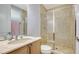 Bathroom with glass enclosed shower with a rain shower head and hand held at 235 Cocoanut Ave # 108B, Sarasota, FL 34236