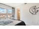 Bedroom with large windows and tile floors, conveniently located next to the bathroom at 235 Cocoanut Ave # 108B, Sarasota, FL 34236