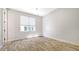 Bedroom with hardwood flooring and large window allowing ample natural light at 235 Cocoanut Ave # 108B, Sarasota, FL 34236