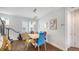 Inviting dining area with stylish light fixture and wood-look floors next to a staircase at 235 Cocoanut Ave # 108B, Sarasota, FL 34236