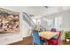 Bright dining room with wood floors, modern lighting, and a view of the staircase at 235 Cocoanut Ave # 108B, Sarasota, FL 34236