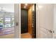 Home elevator in the condo featuring light wood trim, black metal grate and red patterned rug at 235 Cocoanut Ave # 108B, Sarasota, FL 34236