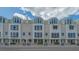 Street view of multi-level condo building, showcasing the well-maintained facade at 235 Cocoanut Ave # 108B, Sarasota, FL 34236