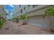 Garages featuring brick paver entry and landscaped entry at 235 Cocoanut Ave # 108B, Sarasota, FL 34236