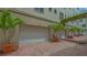 Exterior garages with landscaped entry at 235 Cocoanut Ave # 108B, Sarasota, FL 34236