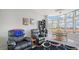 Cozy living room with chairs and large bay windows overlooking the city at 235 Cocoanut Ave # 108B, Sarasota, FL 34236