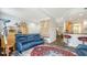 Spacious living room featuring stylish furniture, decor, and an open view into the kitchen at 235 Cocoanut Ave # 108B, Sarasota, FL 34236