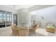 Bright and airy patio featuring wicker furniture, ceiling fan, tile floor and open view at 235 Cocoanut Ave # 108B, Sarasota, FL 34236