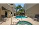 Inviting pool and spa featuring comfortable lounge seating and tropical landscaping at 235 Cocoanut Ave # 108B, Sarasota, FL 34236