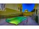 Inviting pool area featuring a rectangular pool, hot tub, lounge chairs and building views at 235 Cocoanut Ave # 108B, Sarasota, FL 34236